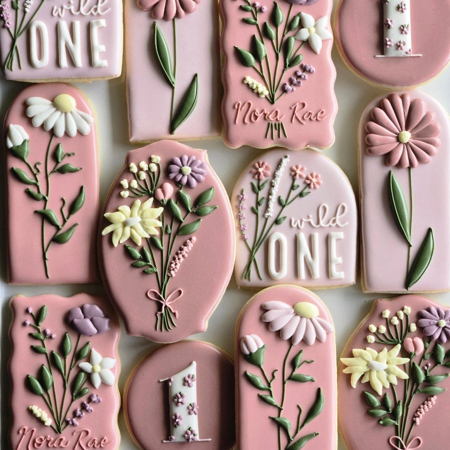Nora Rae 'Wild One' first birthday custom sugar cookies with pink wildflowers, daisies and lavender — Kelowna
